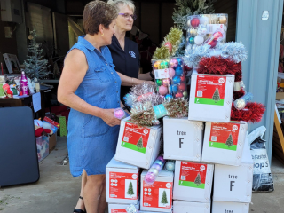 Local women from Lismore sorting through Christmas trees and decorations.