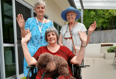 Staff and residents from Churches of Christ's Dianella Apartments with the donated wheelchair