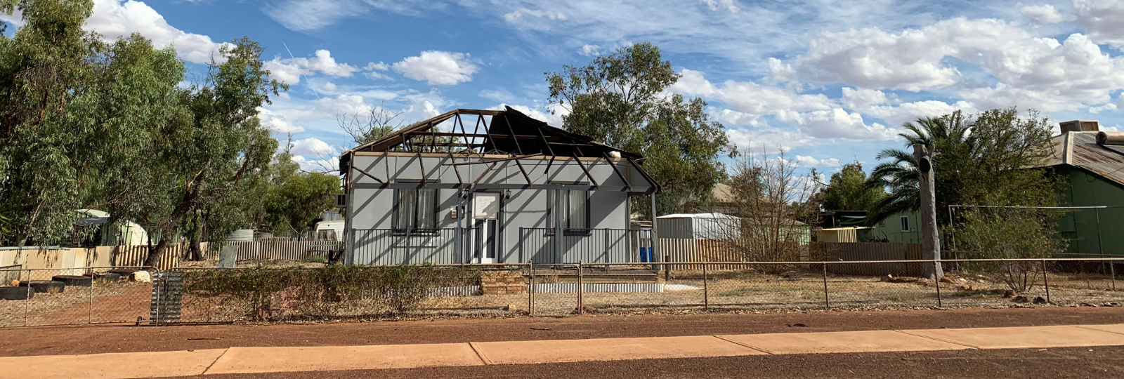 A cyclone-damaged home missing its roof