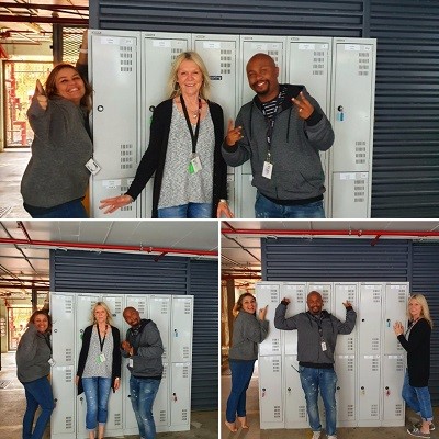 Mission Australia staff with donated lockers from an office relocation