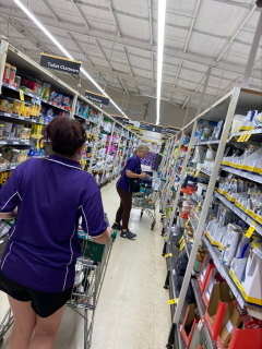 Department of Communities staff purachasing essential items at a supermarket.